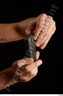 Hands of Max Dior  1 both hands elektronic cigarette…